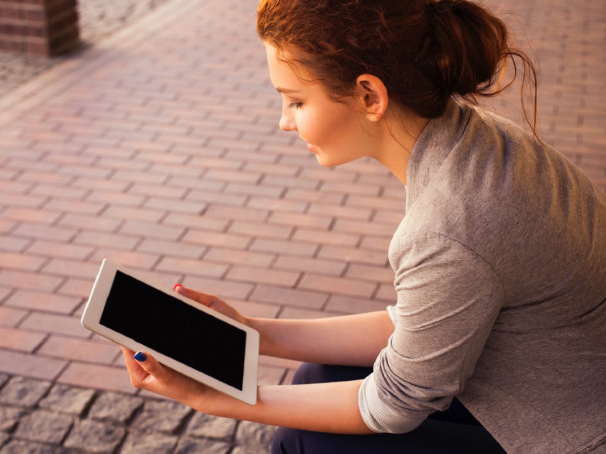 Woman with tablet doing continuous professional development