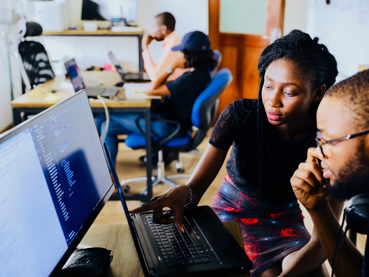 Workers at a computer, workforce planning, career innovation