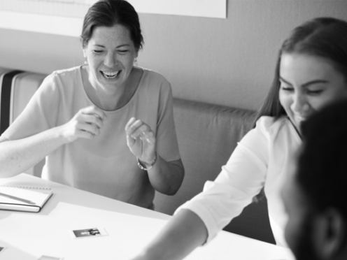 Women at work discussing career strategies for a gender balanced world