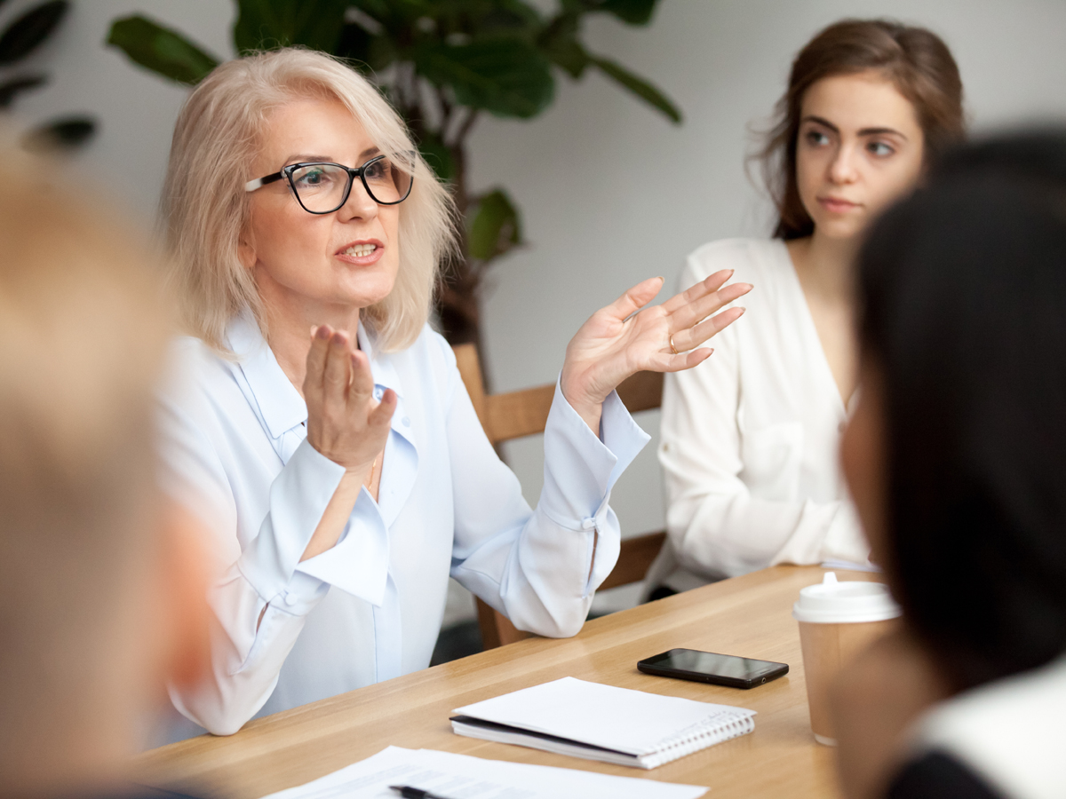 Woman in mid-life asking meeting for career support