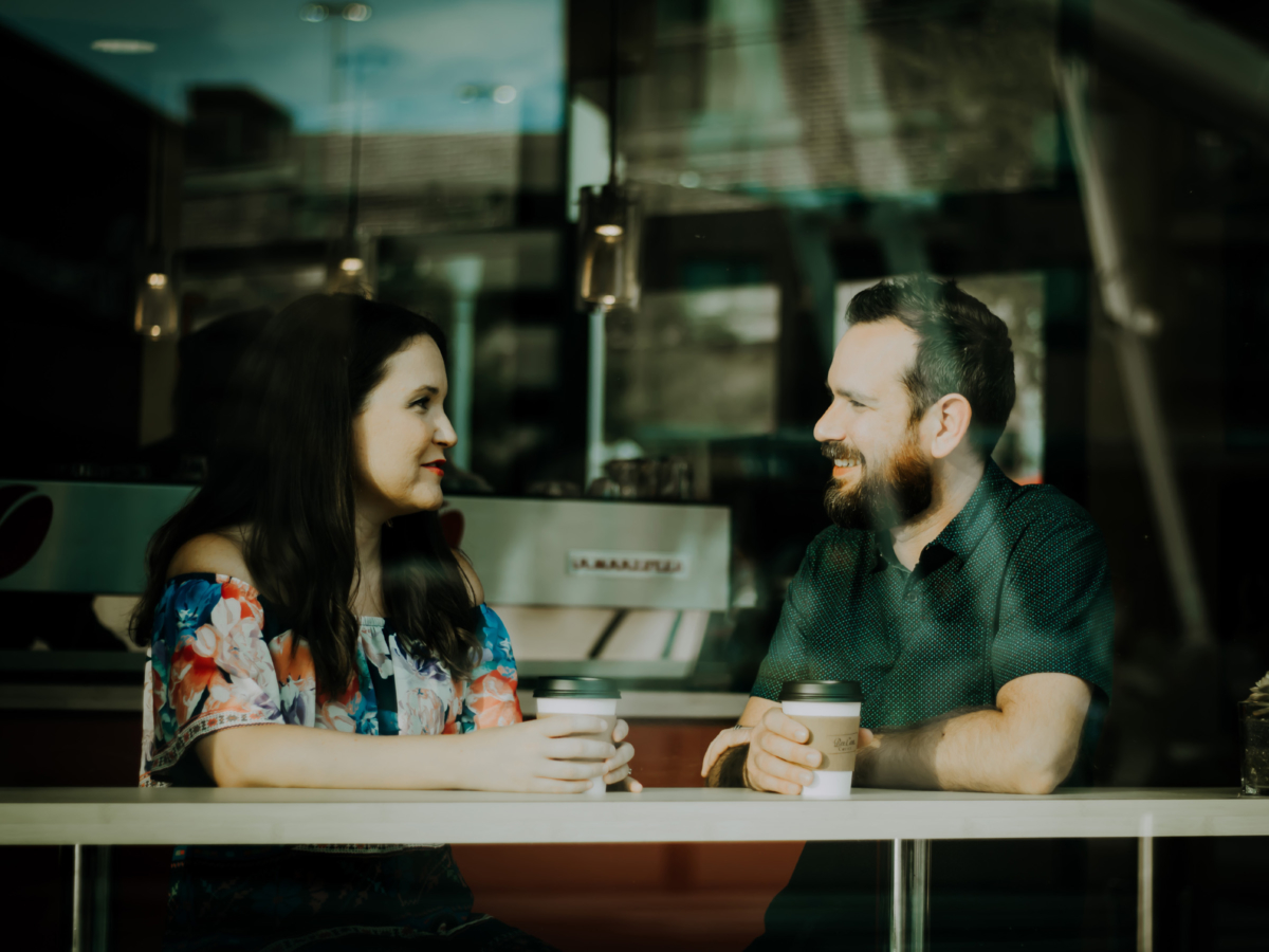 Man and woman networking in a coffee shop