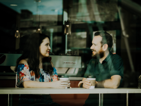 Man and woman networking in a coffee shop