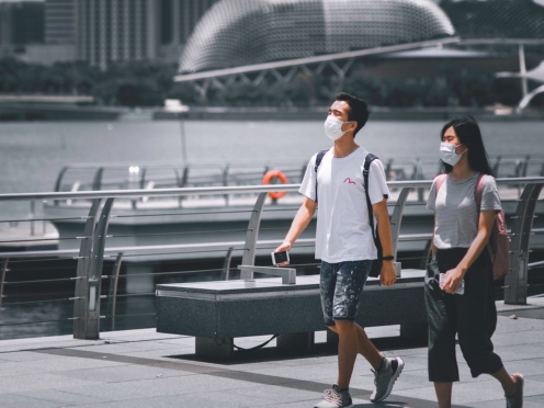 Man and woman wearing masks due to coronavirus restrictions