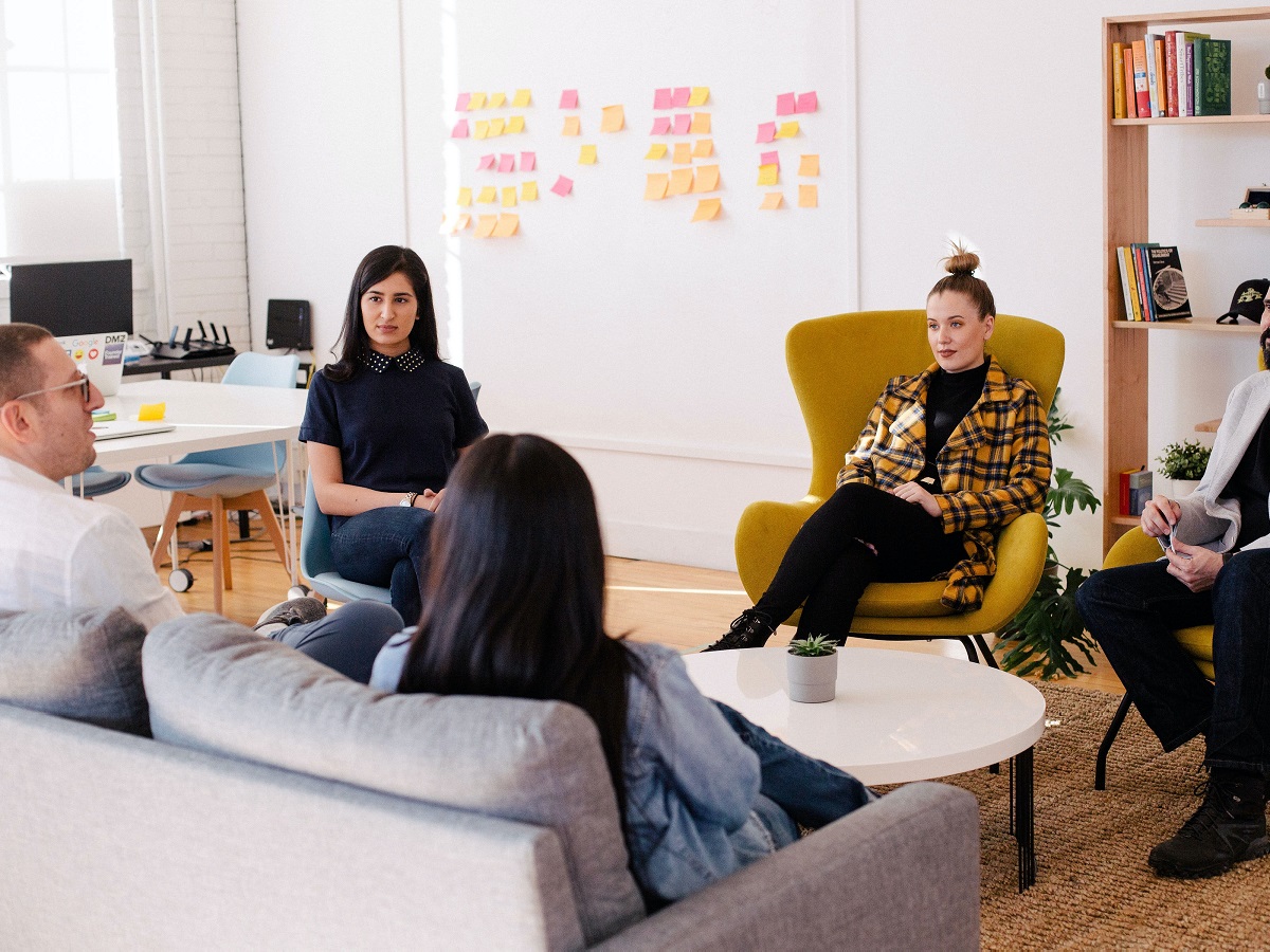 Colleagues in group discussing rebooting careers