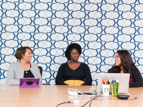 Career women sitting at table